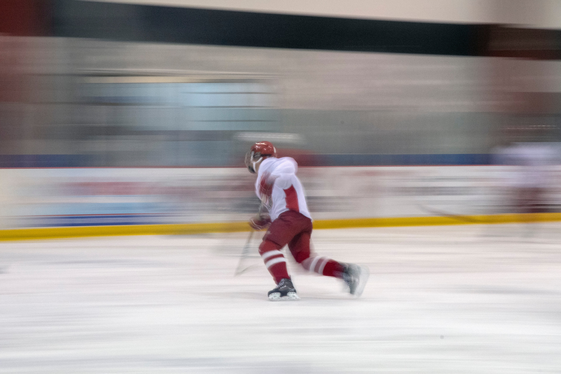 Hockey player in motion playing on the ice